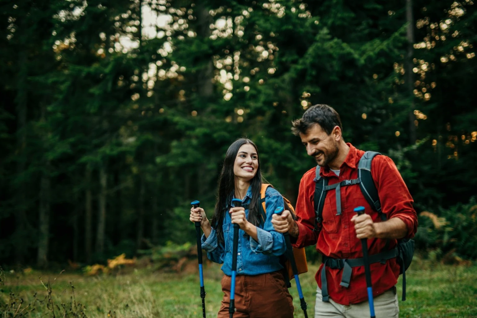 Young couple hiking in Colorado to promote BHRT therapy.